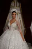 Princess Sparkly Wedding Jurken Ball Gown Illusion v Neck Long Sleeve Sequins Mariage Bridal Jurys Vestido de Noiva