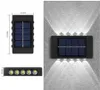 مصابيح الجدار في الهواء الطلق LED LED Solar Fence أضواء لأعلى ولأسفل مصباح يعمل بالطاقة الشمسية مقاوم للماء للمنزل خطوة على سطح السفينة الفناء