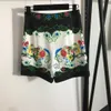 Blusa de designer 23SS Mulheres femininas conjuntos de estampa vintage Drill unhas de lapela de lapela de manga comprida shorts de cintura alta conjunto de roupas femininas roupas