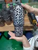 Vasos de viaje de leopardo con estampado holográfico de acero inoxidable de 40 oz con tapas y pajitas Tazas aisladas por mar A0103