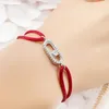 Charm-Armbänder, einfach für Damen, Kupfer-Mikro-eingelegter Zirkon mit einer verschiebbaren Perle, handgewebtes rotes Seil, klassisches Accessoire