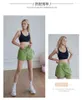 Rennen shorts vrouwelijke zomervakantie twee yogabroeken blootgesteld buiten sportkleding sportschool