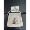 Designer Viviene Westwoods Empress Dowager Sweet Girl Bouton en émail Perle magnétique Saturne Collier Bracelet Lotus Violet Ovale Planète Lisa Même Haute Édition