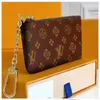 M62650 Nyckelpåse plånböcker cles lyxig designer mode kvinnor mens kreditkort hållare mynt handväska mini plånbok väska charm brun duk