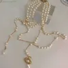 24SS Designer Viviene Westwood Viviennewestwood Empress Dowager Annes Broken Pearl Multi Layered Tassel Saturn Necklace för Womens High Grade Asymmetric Pearl SW