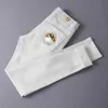 Męski projektant dżinsów mody dżinsy dżinsy haftowane spodnie spodnie szczupte fit Hip Hop White Oversize Pants U73i