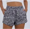 Femmes de yoga tenue camouflage Running shorts sports avec liner latérale poches de gymnase