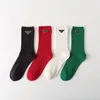 Fashionable luxury P family Christmas vintage gold lettered leather triangle badge design solid color minimalist basic mid tube trendy women's socks ins