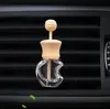 Garrafas de perfume de carro vazias com clipe de madeira oleas essenciais Clipes de ventilação de ar automóveis Auxilino de arco de vidro Decorações de garrafa de vidro Decorações por atacado U0414