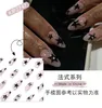 Faux ongles 24pcs artificiel Y2K presse sur l'ongle court d'amande avec des dessins d'étoiles de pentacle noir de petits diamants faux conseils