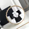 Makeup Bag Purse Fashion Women's Clutch Bag Soft Sheepskin Classic Camellia Gold Hardware Metal Buckle Tote Round Cake Bag Designer Bags