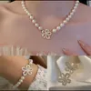 مجموعات مجوهرات الزفاف مجموعة الأزياء الأنيقة زهرة لؤلؤة لؤلؤة للنساء قلادة سوار الحرس