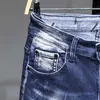メンズジーンズメンズジーンズストリートウェアリッピングデニムパンツトレンドトレンドブランドの男性のためのズボン