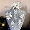 Fermagli per capelli Set di forcine per matrimonio cinese Tessuto fatto a mano Petalo in rilievo Lungo nappa Copricapo Accessori stile sposa