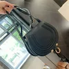 Klassische Kupplungsklappe kleine Sättel Tasche Luxus-Designer-Geldbörse Schulter Neue Art Handtasche Leder Damen Herren Tote Umhängetaschen Verstellbare Schultergurte