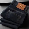 Jeans di marca pantaloni flare da uomo e da donna jeans neri lavati pantaloni casual giovanili in tessuto elastico resistente all'usura in stile europeo e americano