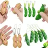 Fidget favors Sojabohnenspielzeug Erdnuss-Erbse Squeeze-a-Bean Schlüsselanhänger Fingerpuzzles Focus Extrusion Erbsenanhänger Stressabbau Kinder mit Autismus brauchen Dekompressionsgeschenk