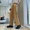 Pantalon pour hommes Bouton en métal Taille élastique Pantalon décontracté Hommes Streetwear Mode Lâche Bureau Trajet Costume Mâle Coréen Vintage Pantalon