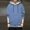 Erkek Hoodies Sweatshirts Erkekler sahte iki parçalı kapüşonlu sweatshirt 2023 Sonbahar ve kış düz renk sıcak gevşek moda çok yönlü erkek kazak ceket zln231114