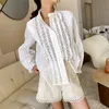 Women's Blouses Shirts T-shirt femme à manches longues célébrité Style Vintage chemisiers en coton blanc évider volants élégant printemps dentelle chemises haut 230414