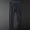 Jeans di marca pantaloni flare da uomo e da donna jeans neri lavati pantaloni casual giovanili in tessuto elastico resistente all'usura in stile europeo e americano