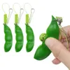 Fidget favors Sojabohnenspielzeug Erdnuss-Erbse Squeeze-a-Bean Schlüsselanhänger Fingerpuzzles Focus Extrusion Erbsenanhänger Stressabbau Kinder mit Autismus brauchen Dekompressionsgeschenk