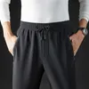 Pantaloni da uomo Moda Sport larghi Casual Autunno Inverno Tinta unita Elastico a vita alta con coulisse Pantaloni semplici da gioventù