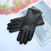 Cinco dedos Guantes de piel de oveja para mujer Cinturón de moda Forro de terciopelo cálido Invierno 231114