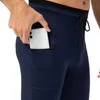 Pantalons pour hommes Pantalons de fitness maigres pour hommes Poche à fermeture éclair Séchage rapide Rebond élevé Course en plein air Entraînement de basket-ball Pantalon de survêtement W0414