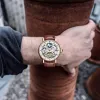 Herren Luxus-Skelett Automatische mechanische Handgelenks Uhren Leder Mond Phrase Luminöse Hände Selbstwind Armbandwatch228s