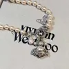 24SS Designer Viviene Westwood Viviennewestwood High Version of Empress Dowager Ship Anchor Saturn Necklace for Female Niche Light Luxury Planet Pearl Colla