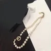 Pendant Necklaces New pearl rhinestone necklace with fashionable and elegant twist pattern collarbone sweater chain jewelry