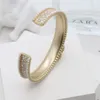 Bijoux de créateurs Plaqué or Laiton Lumière Luxe Haute Qualité Plein Diamant Perles De Riz Tempérament Personnalisé Ouverture Bracelet Décoratif Pour Femmes