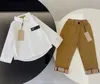 Designer jongens shirt en broek met lange mouwen, tweedelige set nieuwe lente en herfst hoge kwaliteit merk casual mode fan kinderkleding maat 100cm-150cm