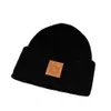 Gorro Diseñador Lujo Invierno Sombrero de punto Cálido Protección para los oídos Moda Moda Gorra al aire libre Temperamento Clásico Color sólido Letra Gorro