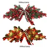 装飾的な花シミュレーションレッドフルーツユニンテル人工花を吊るす装飾ドア窓の壁のための格子縞の弓付きクリスマススワグ