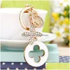 Nyckelringar Luxury Clover Key Chains Keychains Rhinestone Flower Tassel Fashion Metal Keyring Ring Holder Biltillbehör Kvinnor BA DHDJM