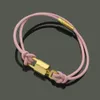 Designer pulseira ouro bloqueio charme pulseiras casal pulseira de aço inoxidável mão corda preto vermelho rosa muitas cores handstrap