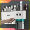 Nova adsorção magnética invertida suporte de escova de dentes parede-automático espremedor de pasta de dentes rack de armazenamento acessórios do banheiro