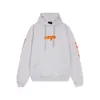 Klassisk lös designer hoodie balencigs mode hoodies hoody mens tröjor högkvalitativ b familj split tryck stänk stänk bläck huva med trasigt tryck på framsidan och