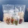 100 st/Lot Clear Zip Lock Poly Plastic Packaging Påsar GRIP SEAL Matväska Stand Up Food Storage Puches With Tea Notch 12x195cm MTEQW