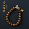 Urok Bracelets Old Sandalwood 8 mm damskie sznur ręczny Nafu z czerwoną 24K Xiangyun China-Chic Bransoleta