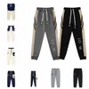 Pantalones de mujer Diseñador Letras Línea Gráfico Mismos hombres Bordado de bolsillo 2023SS Pantalones para correr Pantalones de chándal Tendencia Pantalones de chándal sueltos ocasionales Rayas con cordón