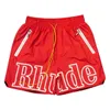 Designer Shorts Rhude Summer Fashion Beach Pants Men High Quality Street Wear Red Blue Black Purple Mens Kort storlek S-XL snabbtorkande andningsbar Casual Fitness Shorts