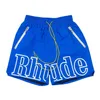 Designer Shorts Rhude Summer Fashion Beach Pants Men High Quality Street Wear Red Blue Black Purple Mens Kort storlek S-XL snabbtorkande andningsbar Casual Fitness Shorts