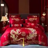 Conjunto de cama Casamento chinês Conjunto de quatro peças Bordado de algodão puro Sala de casamento vermelha brilhante.