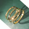 Bangle Design Gold Color Zircon och Cross Nut Nail Armband Gold Bangle For Woman Rostfritt stål Skruvmärke SMycken 231116