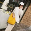 Avondtassen dames eenvoudige Japanse en Koreaanse mode pendelende tas tas stevige kleur grote capaciteit winkelen een schouderhandtas voor