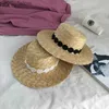 Breda randen hattar hink hattar str att kvinnor bred grimsolskydd strand hatt svart och vit band bowknot str cap casual damer platt topp panama hatt yq231116