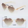 Randlose Großhandelssonnenbrille des Rahmens für Frauen-ursprüngliche weiße echte Horn-Sonnenbrillen-Luxuspfirsich-Herz-Modell männliche und weibliche Diamant-Schnitt-Sonnenbrille Heiß
